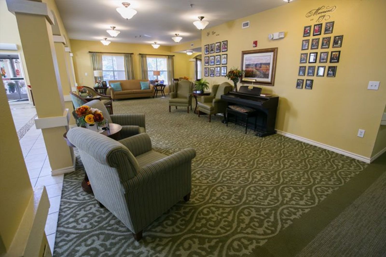 Lobby seating area with piano and warm lighting